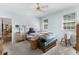 Bedroom features a ceiling fan, two windows, and an ensuite bathroom at 414 Staghorn Ln., Longs, SC 29568