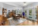 Bright dining room with hardwood floors, a large window, and a view of the outdoors at 414 Staghorn Ln., Longs, SC 29568