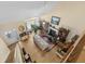 Sunlit living room with hardwood floors, fireplace, and tall ceilings at 414 Staghorn Ln., Longs, SC 29568