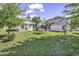 Spacious backyard featuring well-maintained grass and a screened in porch at 431 Brandymill Blvd, Myrtle Beach, SC 29588