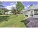 Spacious backyard featuring well-maintained grass and a screened in porch at 431 Brandymill Blvd, Myrtle Beach, SC 29588
