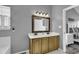 Bathroom features a double sink vanity with an ornate mirror and neutral paint at 431 Brandymill Blvd, Myrtle Beach, SC 29588