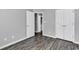 Bedroom boasting wood-look flooring, neutral walls, and a large closet for storage at 431 Brandymill Blvd, Myrtle Beach, SC 29588