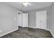 Bedroom featuring wood-look flooring, neutral walls, and two closets for storage at 431 Brandymill Blvd, Myrtle Beach, SC 29588
