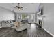 Spacious living room featuring neutral décor, vaulted ceilings, a fireplace, and wood-look flooring at 431 Brandymill Blvd, Myrtle Beach, SC 29588