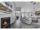 Open floor plan featuring fireplace and view into kitchen and dining area at 431 Brandymill Blvd, Myrtle Beach, SC 29588