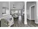 Open-concept living room with modern gray walls, vaulted ceilings and luxury vinyl plank flooring at 431 Brandymill Blvd, Myrtle Beach, SC 29588