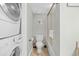 Full bathroom with a shower-tub combo, toilet, and laundry facilities at 4311 S Ocean Blvd. # 701, North Myrtle Beach, SC 29582