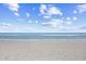 Calm beach scene with a sandy shore, gentle waves, and a serene sky, perfect for a relaxing day at 4311 S Ocean Blvd. # 701, North Myrtle Beach, SC 29582