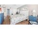 Comfortable bedroom with bright quilt, rocker, and access to hall with ensuite bathroom at 4311 S Ocean Blvd. # 701, North Myrtle Beach, SC 29582