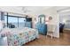 Relaxing main bedroom with ocean view, balcony access, nautical décor, and bright, natural light at 4311 S Ocean Blvd. # 701, North Myrtle Beach, SC 29582
