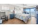 Cozy bedroom featuring ocean view balcony access, rocking chair, and coastal-themed decor at 4311 S Ocean Blvd. # 701, North Myrtle Beach, SC 29582