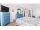 Serene bedroom with blue furniture, nautical accents, and view into hall at 4311 S Ocean Blvd. # 701, North Myrtle Beach, SC 29582
