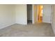 Bedroom showing closet and bathroom doors and plush neutral carpeting at 5020 Windsor Green Way # 302, Myrtle Beach, SC 29579