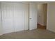 Carpeted bedroom with closet and light-colored walls at 5020 Windsor Green Way # 302, Myrtle Beach, SC 29579