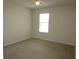 Neutral bedroom with carpet, ceiling fan, and a window for natural light at 5020 Windsor Green Way # 302, Myrtle Beach, SC 29579