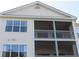 Exterior close-up of a condo with screened-in patios at 5020 Windsor Green Way # 302, Myrtle Beach, SC 29579
