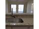 Kitchen featuring granite countertops and a stainless steel sink at 5020 Windsor Green Way # 302, Myrtle Beach, SC 29579