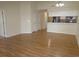 Open floor plan featuring hardwood floors and a breakfast bar overlooking a modern kitchen at 5020 Windsor Green Way # 302, Myrtle Beach, SC 29579