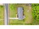 Aerial view of a home with a well-maintained roof, large yard, and driveway at 5033 Brantwood Dr., Mullins, SC 29574