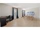 Bright bedroom features hardwood floors, a desk, and unique window coverings, bathed in natural light at 5033 Brantwood Dr., Mullins, SC 29574
