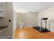 Bedroom featuring hardwood floors, a window, and a treadmill ready for workouts at 5033 Brantwood Dr., Mullins, SC 29574