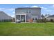 Expansive backyard with a lush green lawn, and a screened in porch at 5039 Gladstone Dr, Conway, SC 29526