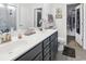 Bathroom featuring double sinks, granite countertops, gray cabinets, and walk-in closet at 5039 Gladstone Dr, Conway, SC 29526