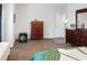 A bedroom with a warm aesthetic featuring wood-look floors and matching dressers at 5039 Gladstone Dr, Conway, SC 29526