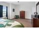 A well-lit bedroom with neutral walls, wood-look flooring, and matching dressers at 5039 Gladstone Dr, Conway, SC 29526