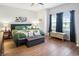 Bright bedroom with hardwood floors, large windows, and a calming color scheme at 5039 Gladstone Dr, Conway, SC 29526