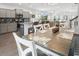 Open concept kitchen and dining area features grey cabinets, stainless appliances, and wood-style flooring at 5039 Gladstone Dr, Conway, SC 29526