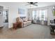 Cozy living room with a comfortable reclining sofa and light-filled windows and plush carpeting at 5039 Gladstone Dr, Conway, SC 29526