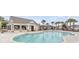 Inviting community pool surrounded by palm trees, perfect for relaxation and recreation at 5039 Gladstone Dr, Conway, SC 29526