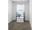 Comfortable sitting area with a window, a planter and neutral walls and plush carpeting at 5039 Gladstone Dr, Conway, SC 29526