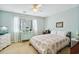 Cozy bedroom featuring a floral quilt, a ceiling fan, and a light blue dresser at 504 A S 19Th Ave. S, North Myrtle Beach, SC 29582