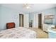 Well-lit bedroom with floral bedding, a TV, and ample closet space at 504 A S 19Th Ave. S, North Myrtle Beach, SC 29582