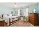 This primary bedroom features a ceiling fan, a double bed, a dresser and a large rug at 504 A S 19Th Ave. S, North Myrtle Beach, SC 29582