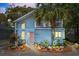 Charming two-story home with a light blue exterior, balcony, and beautiful landscaping at 504 A S 19Th Ave. S, North Myrtle Beach, SC 29582