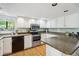 Well-maintained kitchen with white cabinets, modern appliances, and a breakfast bar at 504 A S 19Th Ave. S, North Myrtle Beach, SC 29582