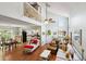 This living room features high ceilings, hardwood floors, lots of natural light, and an open floor plan at 504 A S 19Th Ave. S, North Myrtle Beach, SC 29582