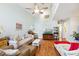 The living room features high ceilings, comfortable seating, and wood laminate flooring at 504 A S 19Th Ave. S, North Myrtle Beach, SC 29582