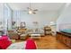 Bright living room featuring hardwood floors, a ceiling fan, and comfortable furnishings at 504 A S 19Th Ave. S, North Myrtle Beach, SC 29582