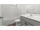 Bathroom featuring a bathtub, toilet, sink, cabinets and vinyl floors at 512 Charlton Blvd., Georgetown, SC 29440