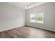 Bright dining room with wood floors, a chandelier, and a large window at 512 Charlton Blvd., Georgetown, SC 29440