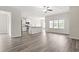 Open living area featuring wood flooring and a view of the kitchen and backyard at 512 Charlton Blvd., Georgetown, SC 29440