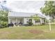 Enjoy this outdoor space featuring a covered patio and a lush green yard, perfect for relaxing and entertaining at 521 Oak Lawn Rd., Georgetown, SC 29440