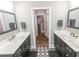 Bright bathroom featuring dual vanities, marble countertops, and decorative tile flooring at 521 Oak Lawn Rd., Georgetown, SC 29440