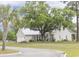 Beautiful home with a metal roof, two-car garage, and inviting front porch, all set on a spacious lot with mature trees at 521 Oak Lawn Rd., Georgetown, SC 29440