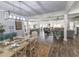 Spacious living area seamlessly connects the dining, kitchen, and living spaces with wood floors and an open layout at 521 Oak Lawn Rd., Georgetown, SC 29440